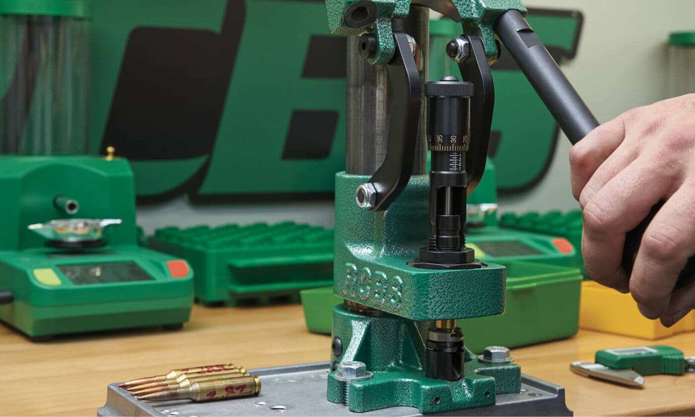 Close-up detail of a reloader using the Summit Single Stage Reloading Press